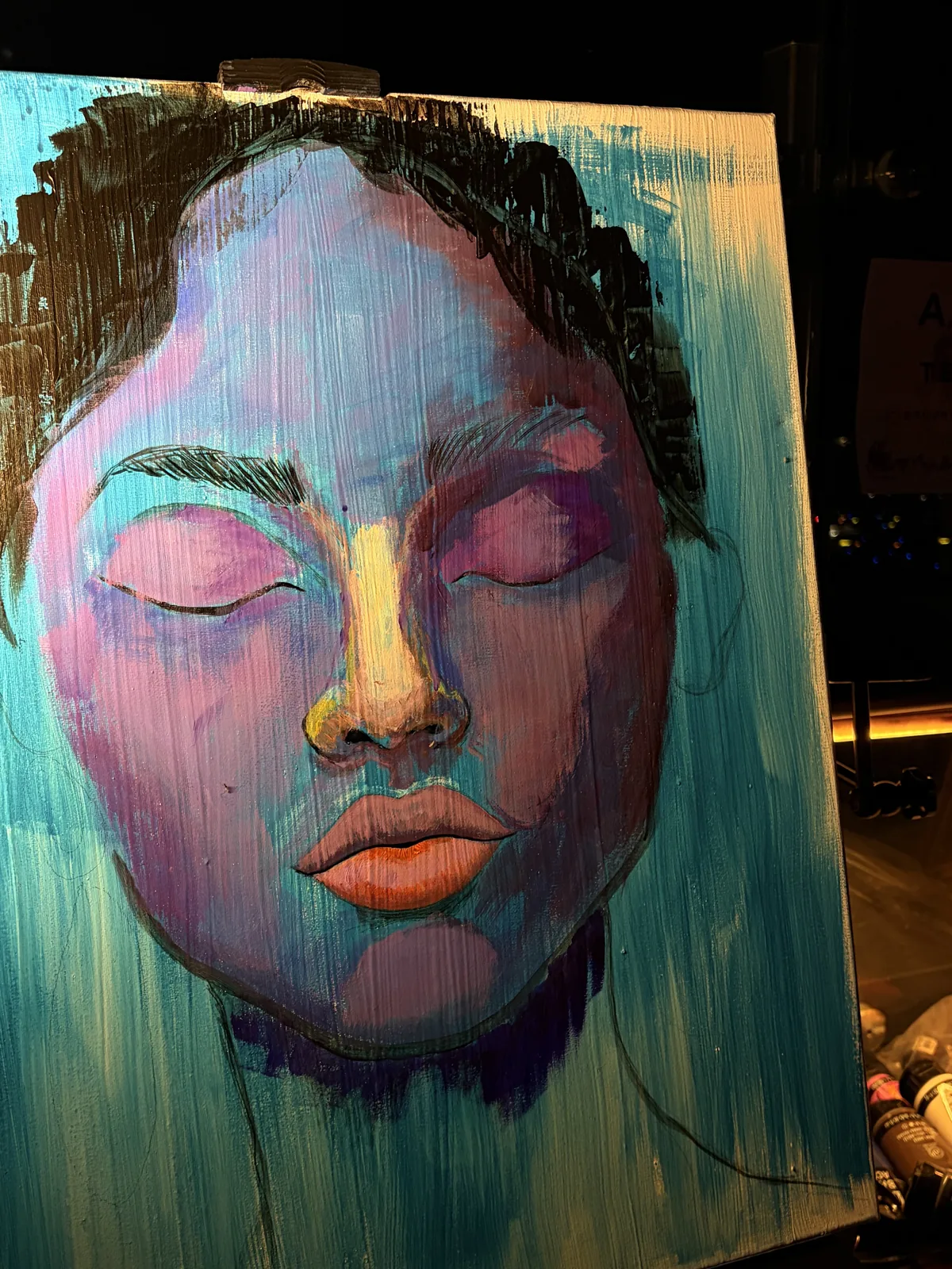Abstract portrait in blue, pink and teal with orange lips